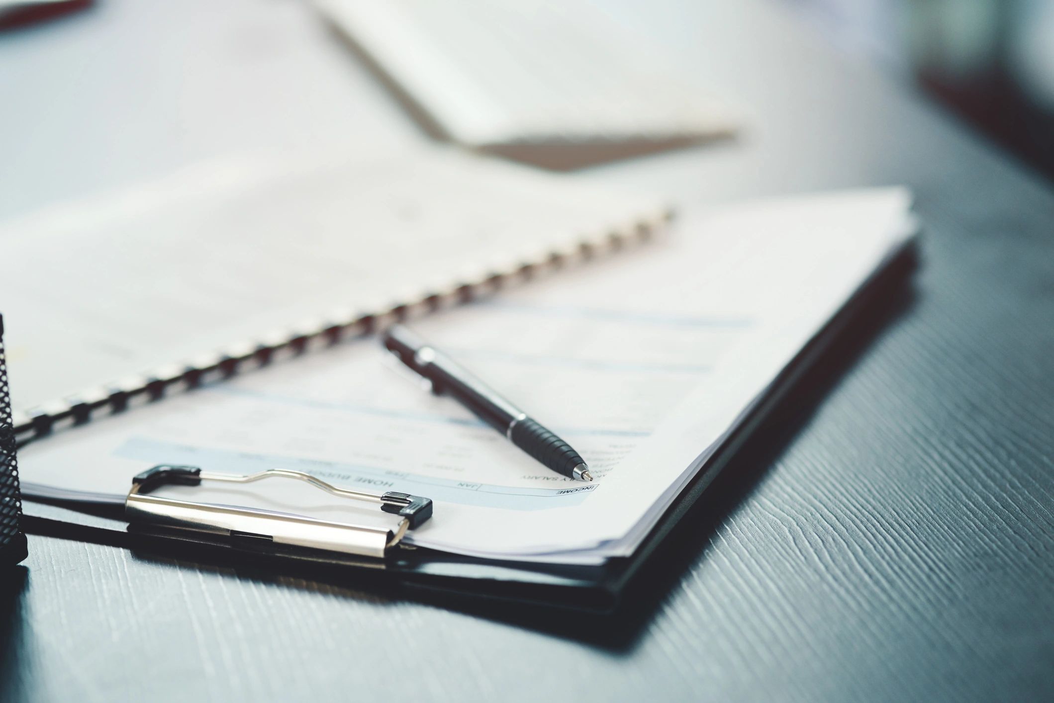 Organized desk with notebook and pen for legal planning
