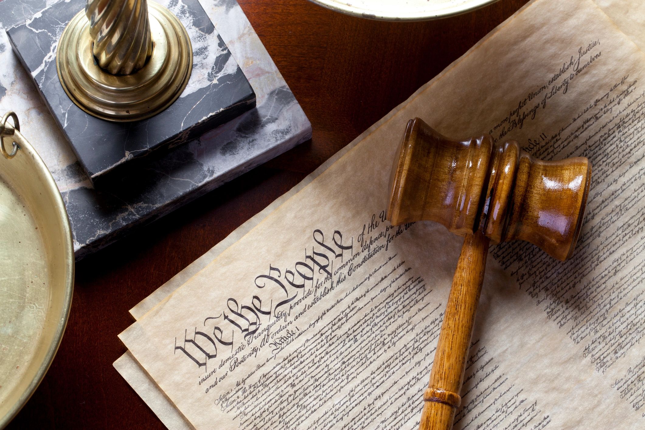 Scales of justice with legal documents
